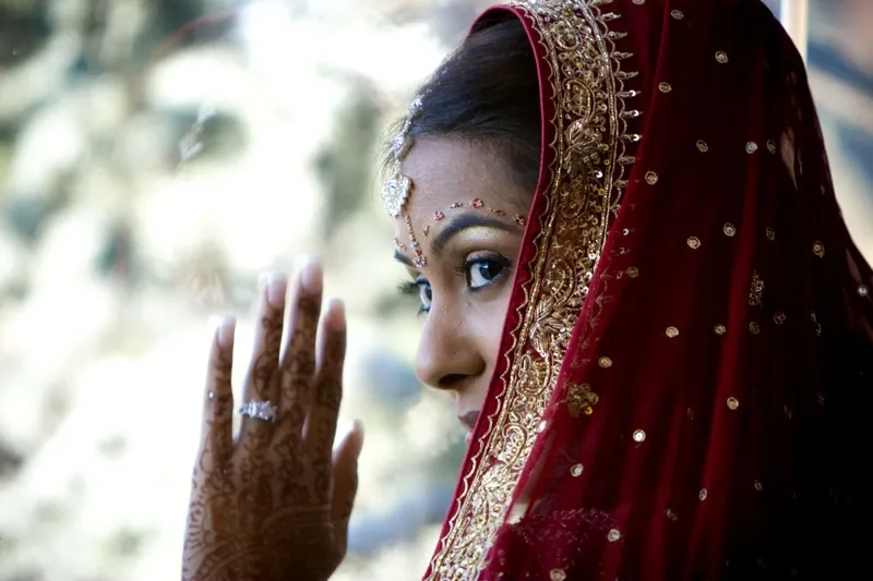 Bridal side profile with traditional veil and wedding jewelry